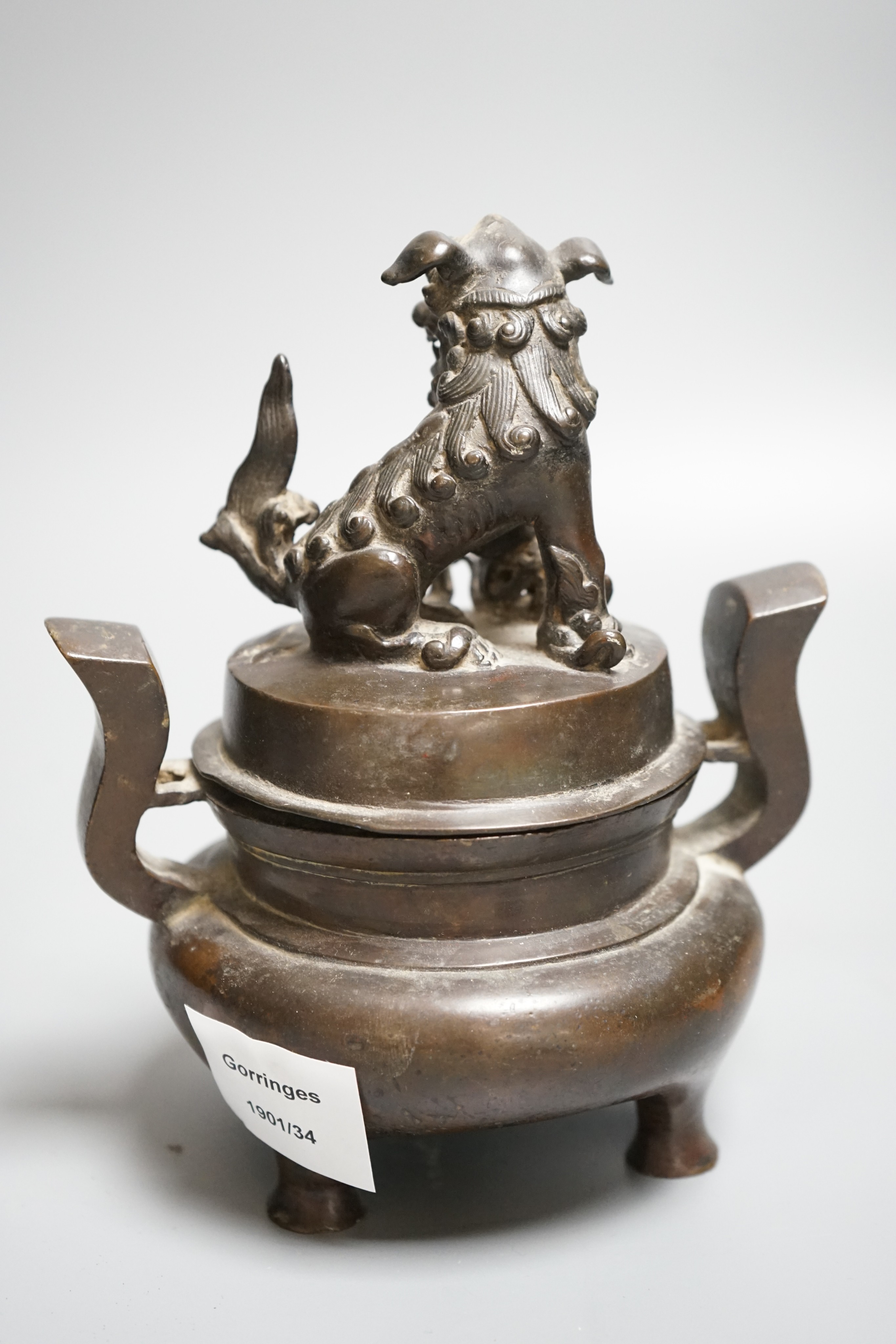 A Chinese copper alloy censer and cover with lion dog cover, height 20cm